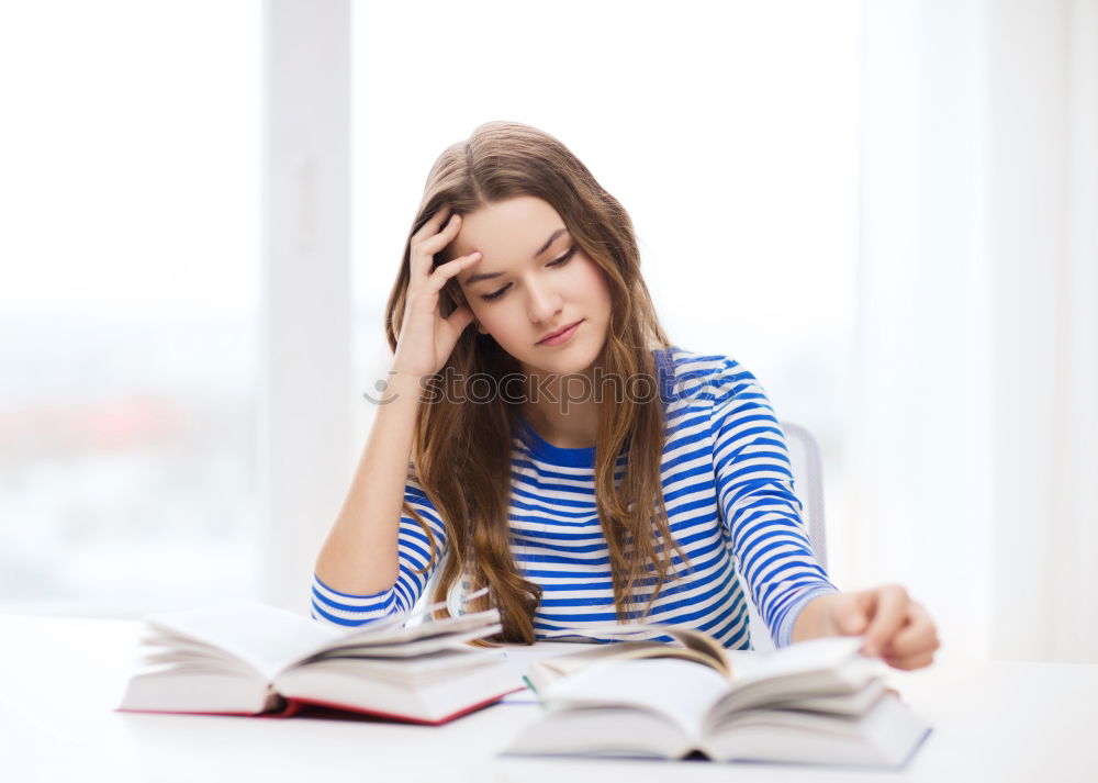 Similar – woman reading a book