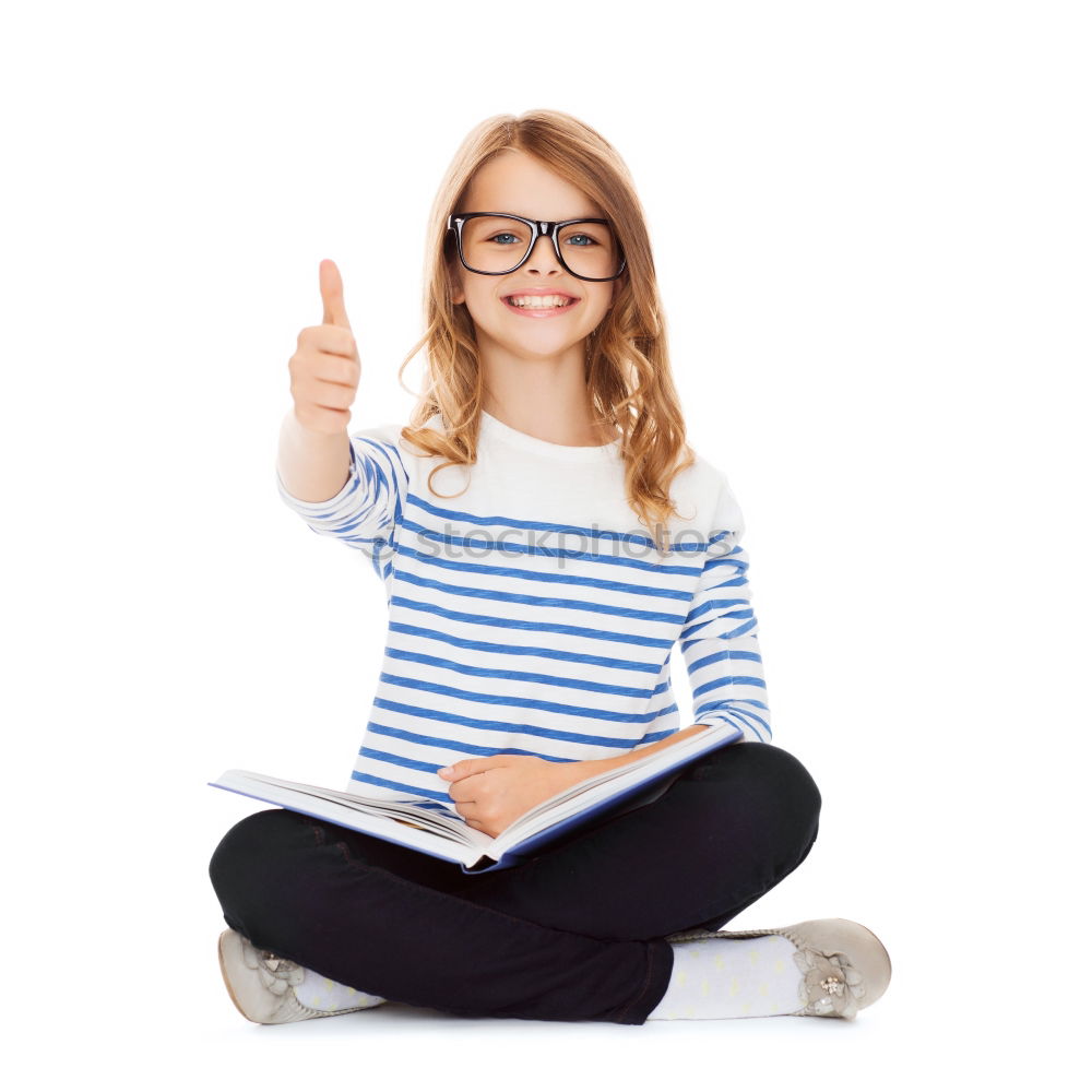 Similar – Image, Stock Photo Schoolgirl reading a book in classroom