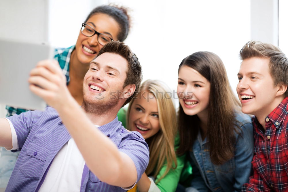 Similar – Group of friends taking selfie in urban park