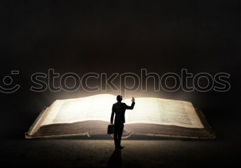 Similar – Image, Stock Photo A hand that holds a Bible in the air