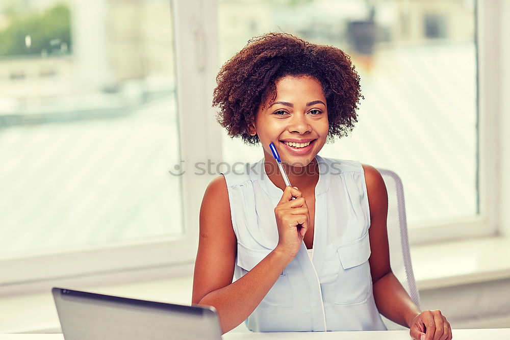 Similar – Beautiful afro american woman using mobile and laptop in the coffee shop.