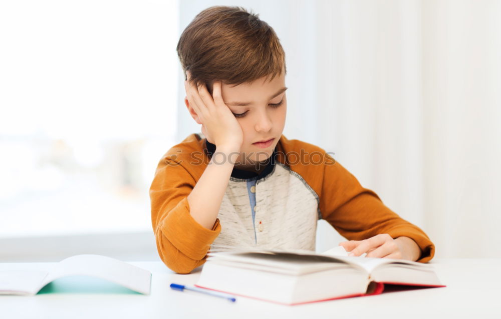 Similar – Concentrated child studying