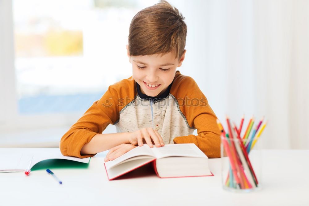 Similar – Concentrated child studying