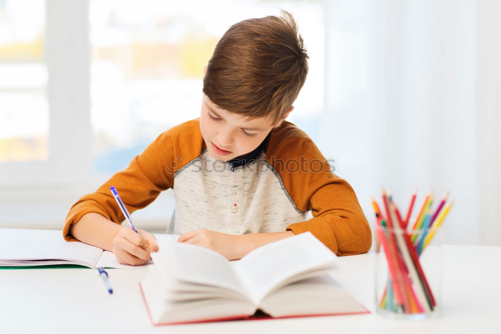 Similar – Concentrated child studying