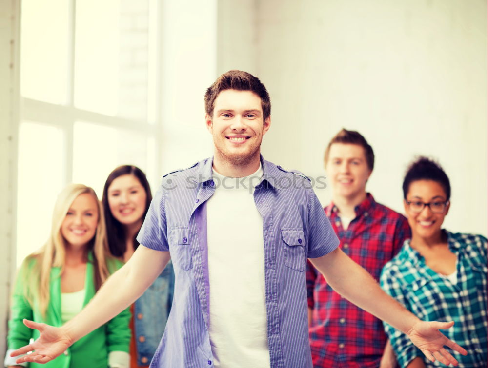 Similar – Group of multi-ethnic young people having fun together outdoors in urban background