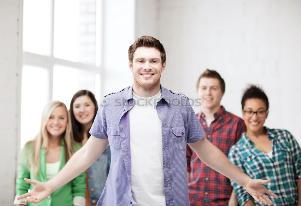 Similar – Group of multi-ethnic young people having fun together outdoors in urban background