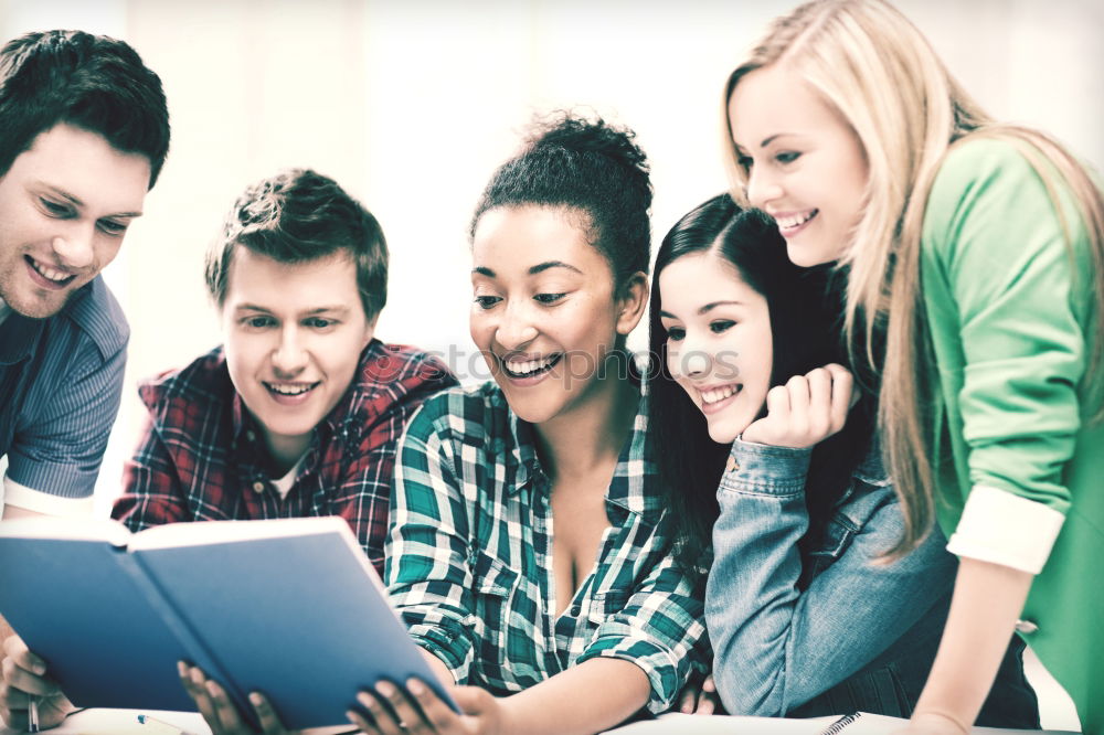 Similar – Image, Stock Photo Multi-ethnic group of young people looking at a tablet computer outdoors