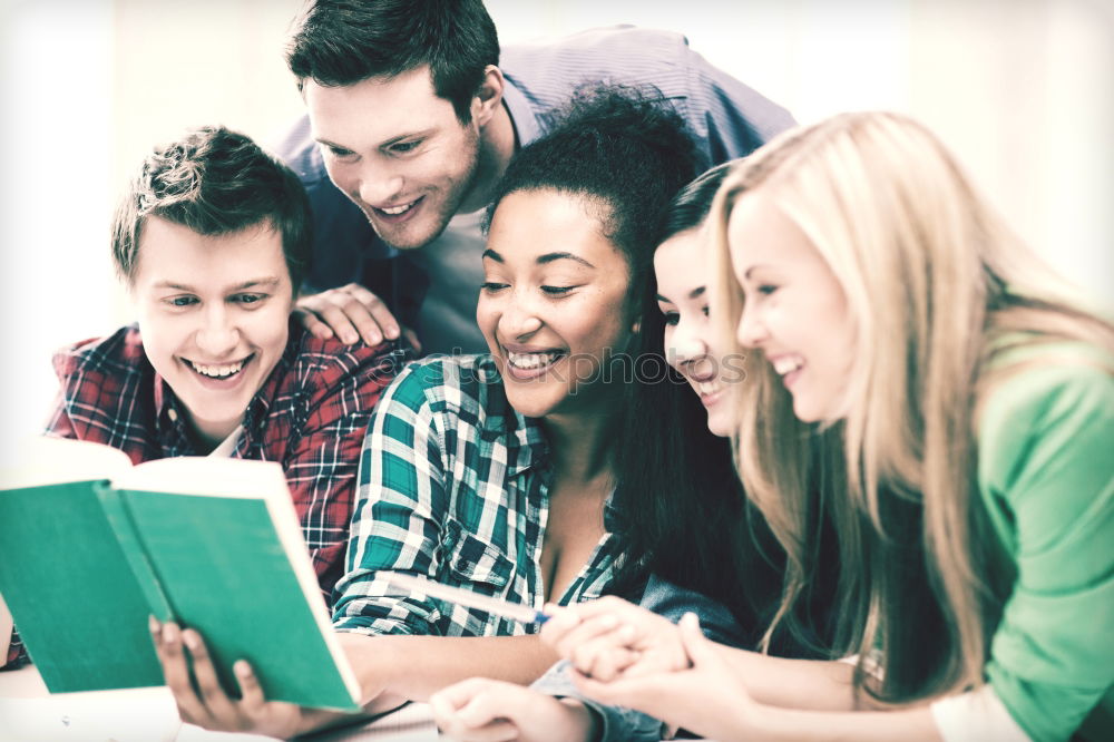 Similar – Image, Stock Photo Multi-ethnic group of young people looking at a tablet computer outdoors