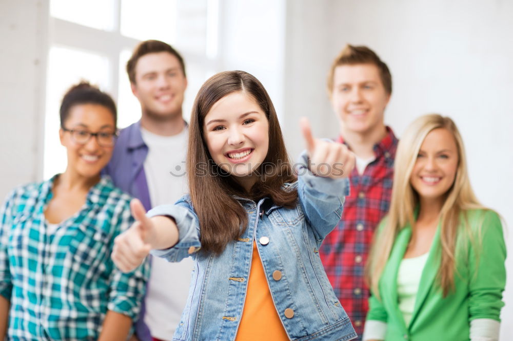 Similar – Group of multi-ethnic young people having fun together outdoors in urban background