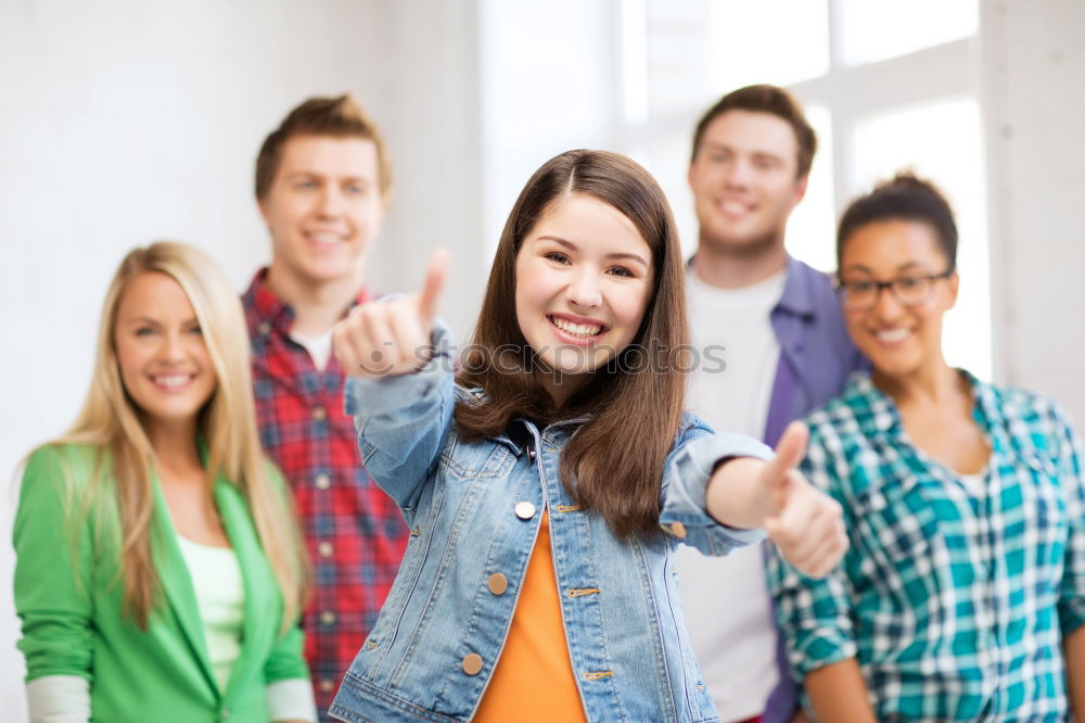 Similar – Group of multi-ethnic young people having fun together outdoors in urban background