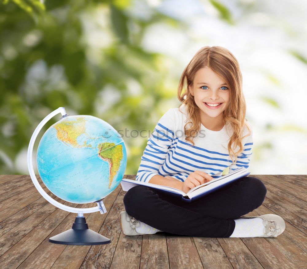 Similar – Image, Stock Photo Schoolgirl covering face with globe