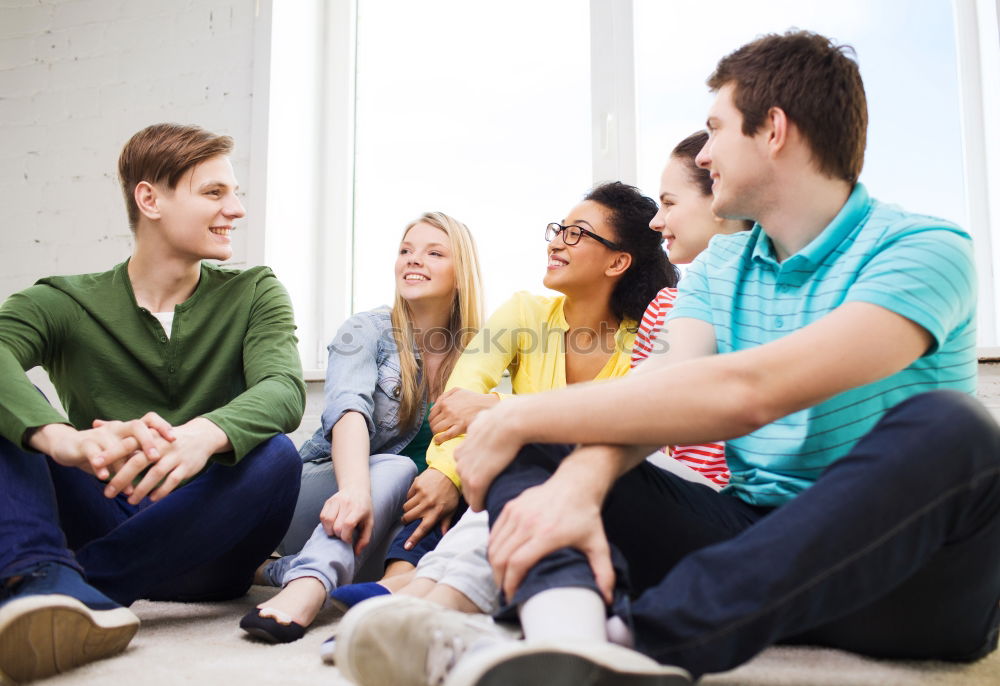 Group of multi-ethnic young people together outdoors