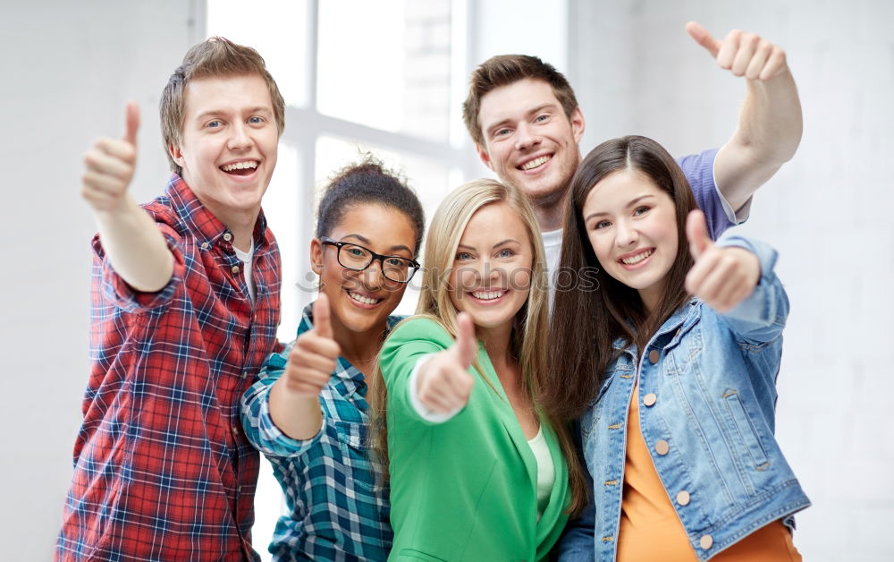 Similar – Group of multi-ethnic young people having fun together outdoors in urban background