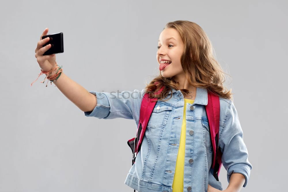 portrait of a beautiful kid using mobile phone