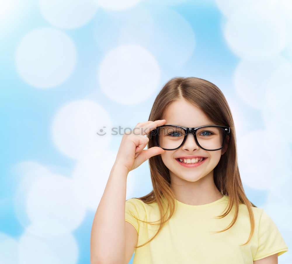 Similar – smiling baby with an orange on blue background