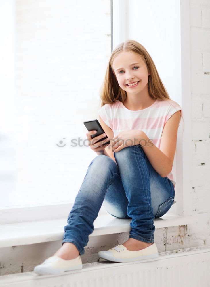 Similar – Little girl using a tablet at home