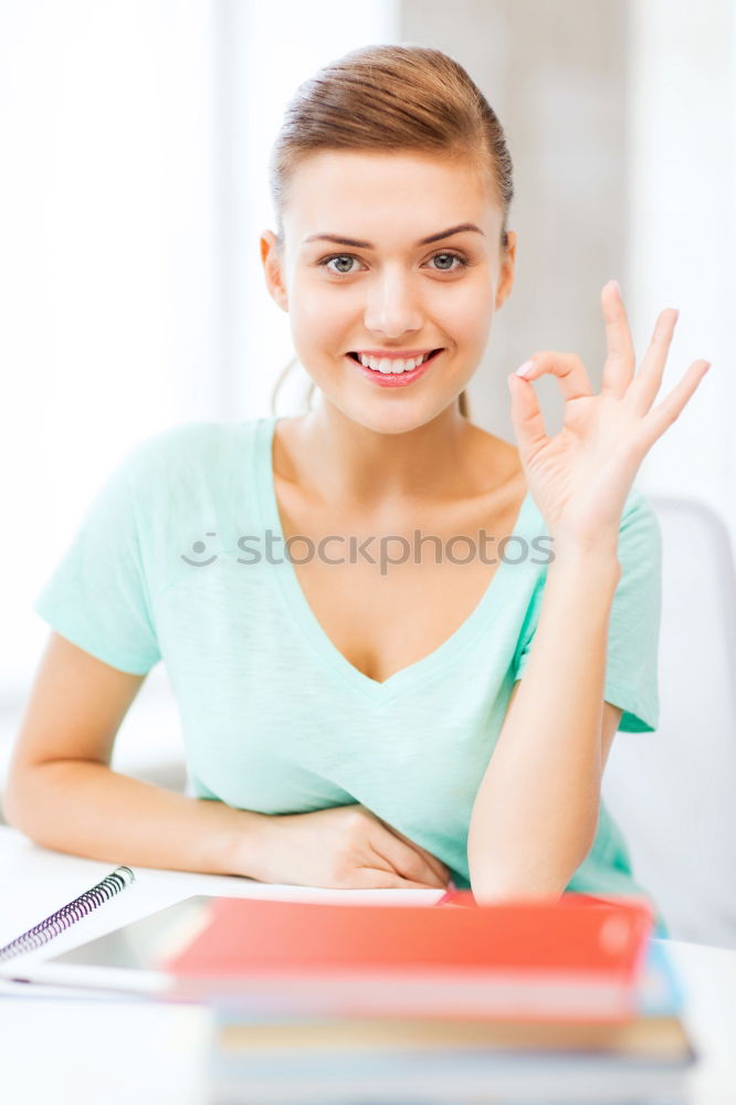 Similar – Image, Stock Photo Schoolgirl reading a book in classroom