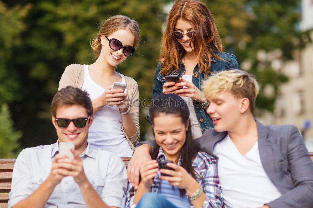 Similar – Multi-ethnic group of young people using smartphone