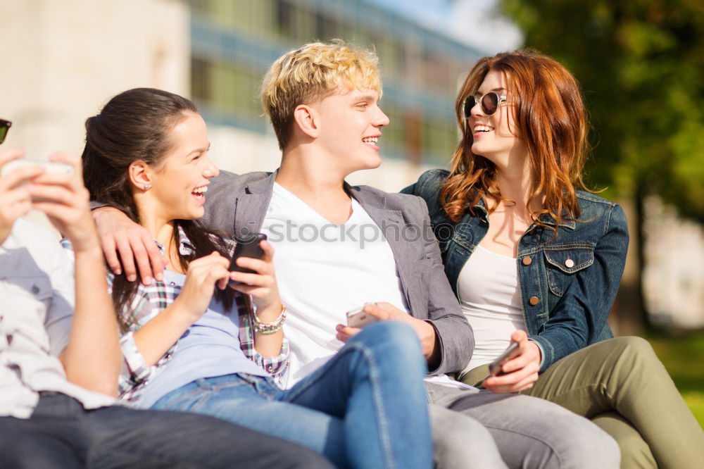 Multi-ethnic group of young people using smartphone