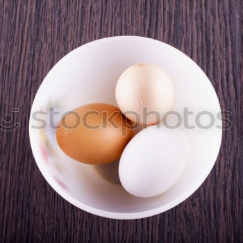 Similar – Image, Stock Photo Fresh eggs in a cardbox tray.