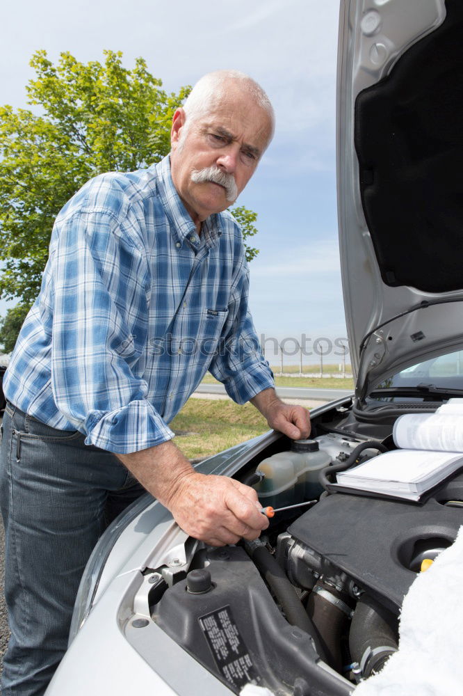 Similar – young guy repairing an old car