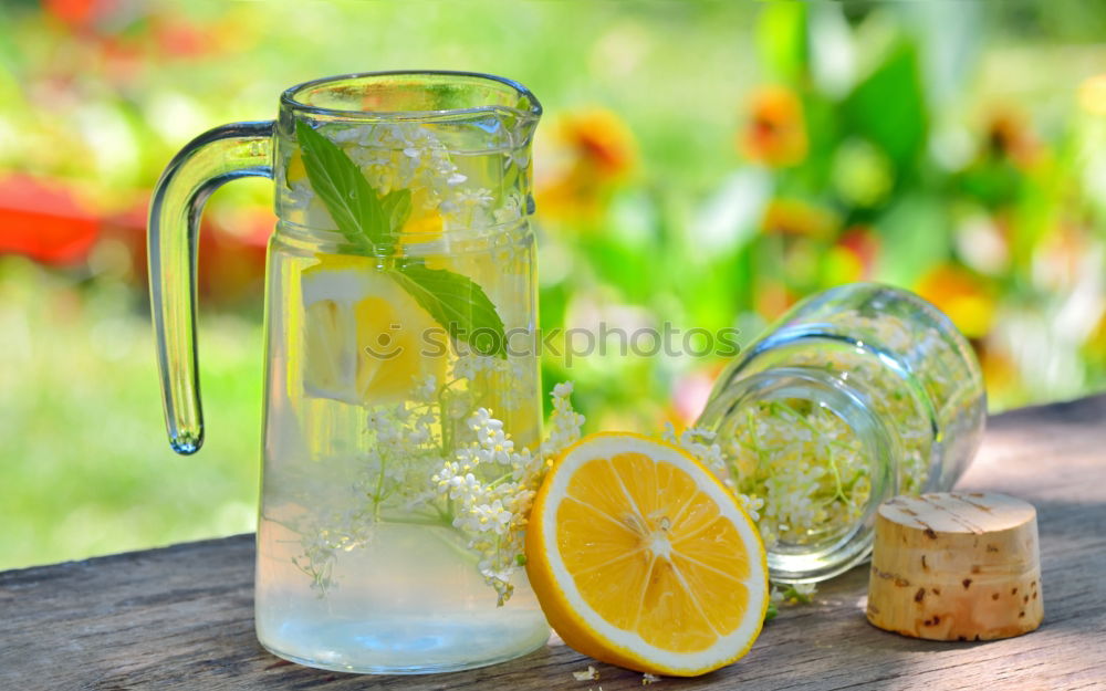 Similar – Elder lemonade with lemon on old table wood