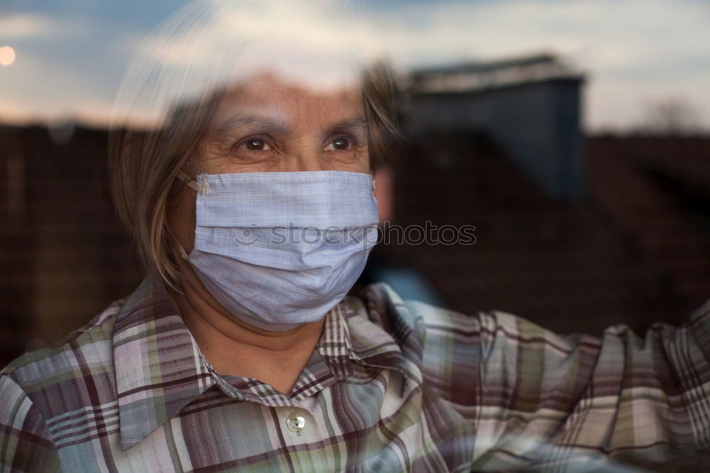 Similar – young woman wearing a mask and fogged glasses in autumn / winter (Corona / Covid-19)