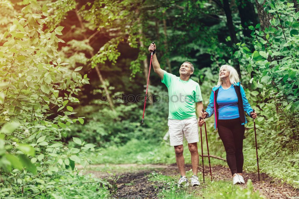 Similar – Couple of hikers doing trekking