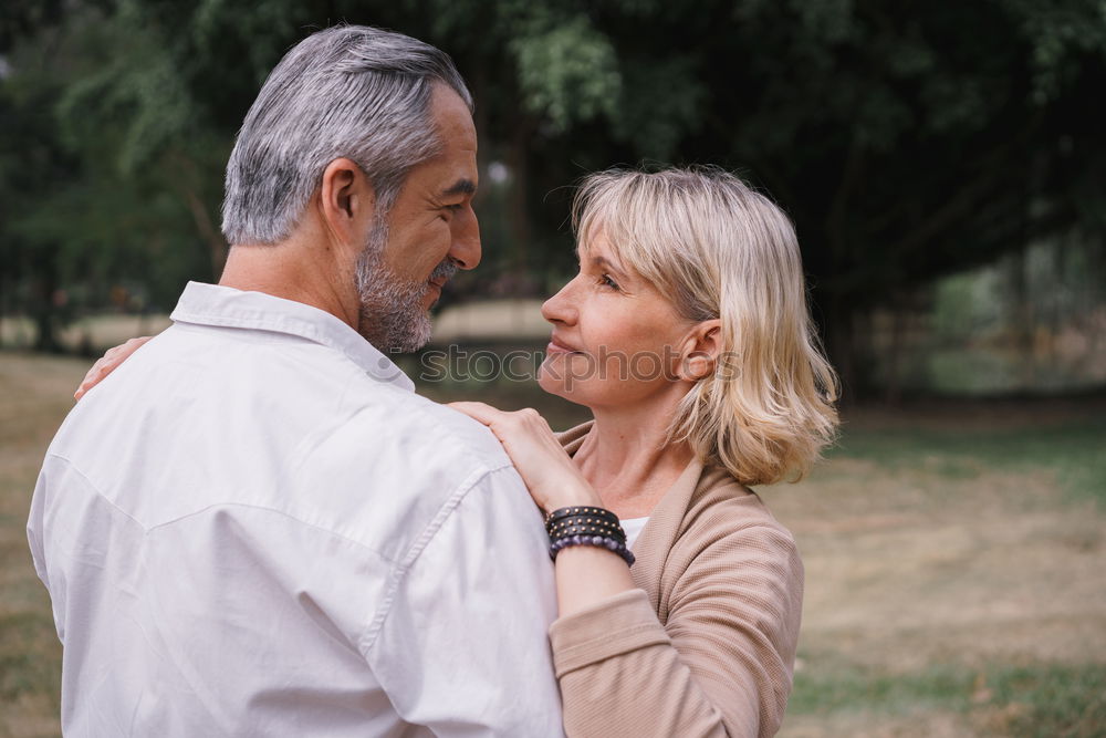 Similar – Image, Stock Photo Young smiling couple on a path in the park.