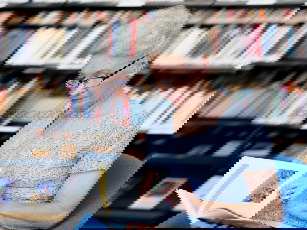 Similar – Image, Stock Photo Elderly woman wearing glasses sitting in her living room reading a letter, closeup portrait
