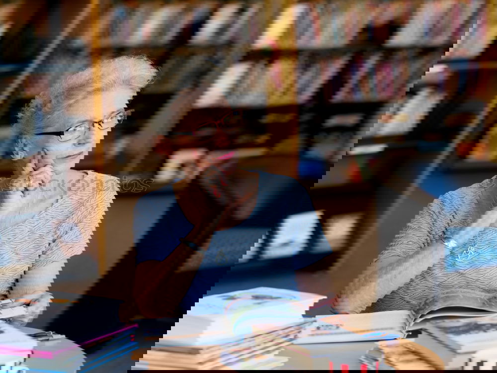 Similar – Image, Stock Photo Elderly woman wearing glasses sitting in her living room reading a letter, closeup portrait