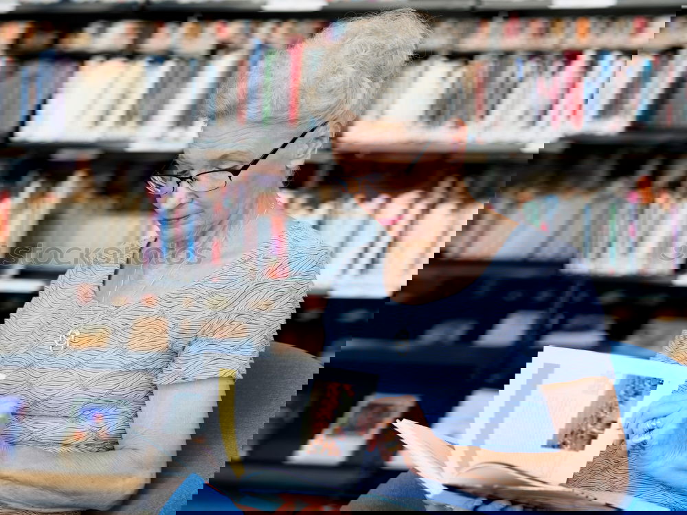 Similar – Image, Stock Photo Elderly woman wearing glasses sitting in her living room reading a letter, closeup portrait