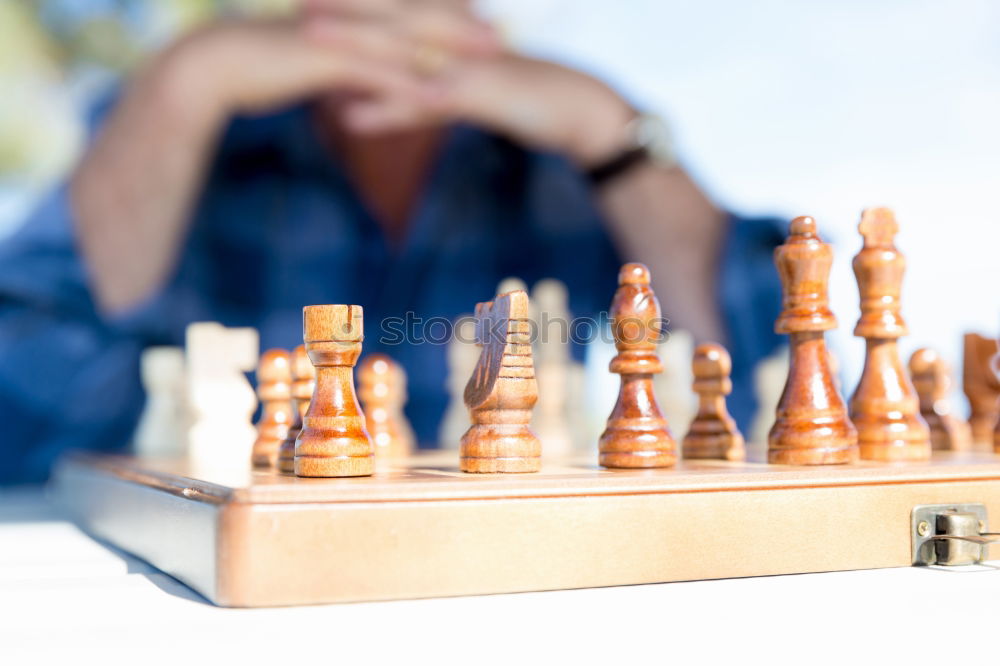 Similar – Girl and boy playing chess at home.