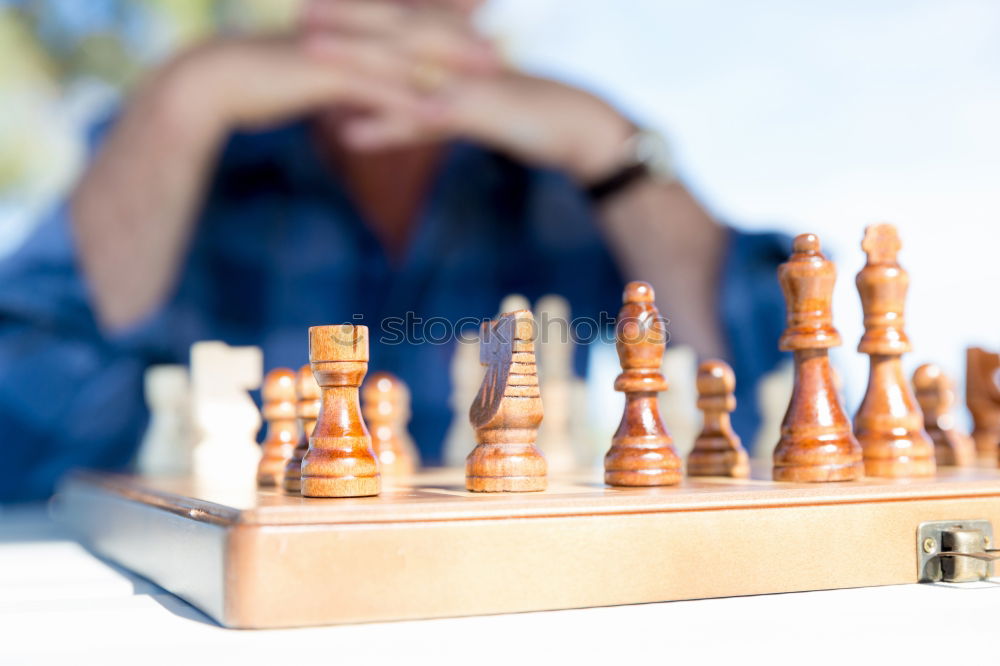 Similar – Girl and boy playing chess at home.