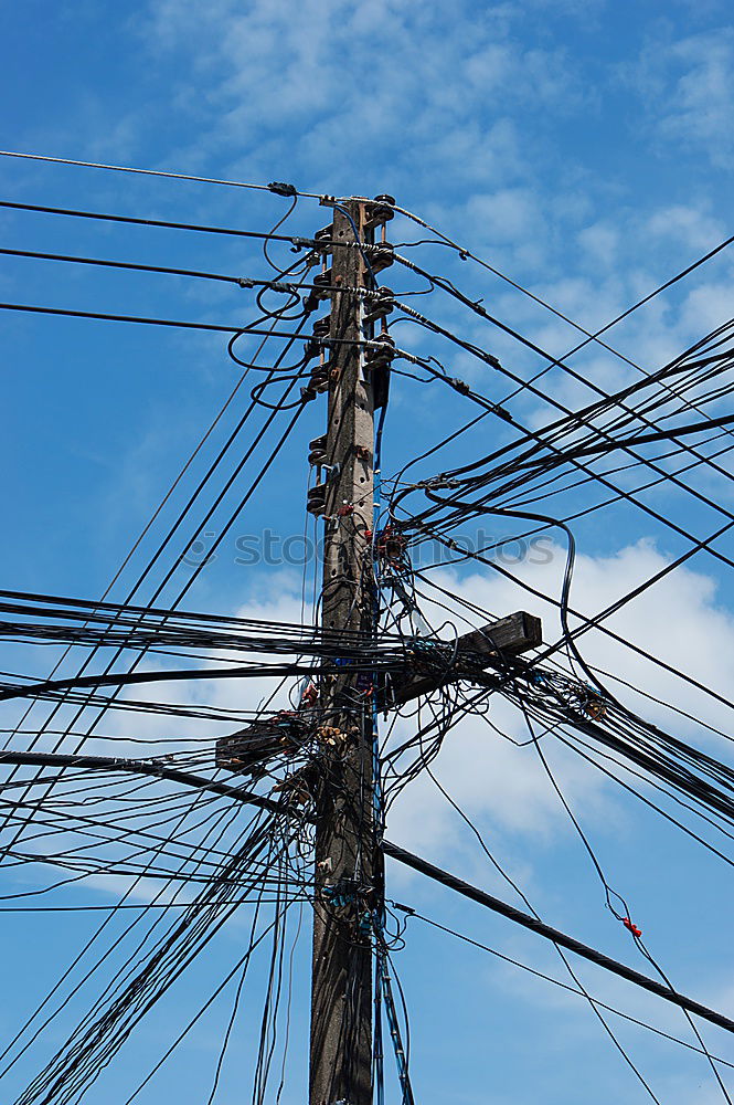 Similar – Tangled electrical wires on urban electric pole. Disorganized and messy to organization management concept. Closeup tangled electrical wires . Should take underground wire for beautiful landscape.