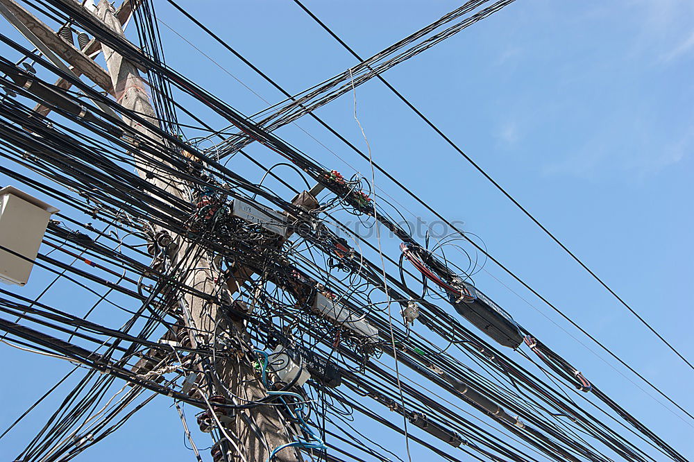 Similar – Tangled electrical wires on urban electric pole. Disorganized and messy to organization management concept. Closeup tangled electrical wires . Should take underground wire for beautiful landscape.