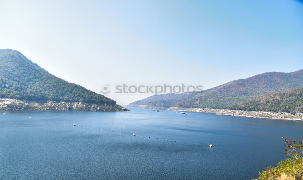 Similar – Calm river flowing between green hills