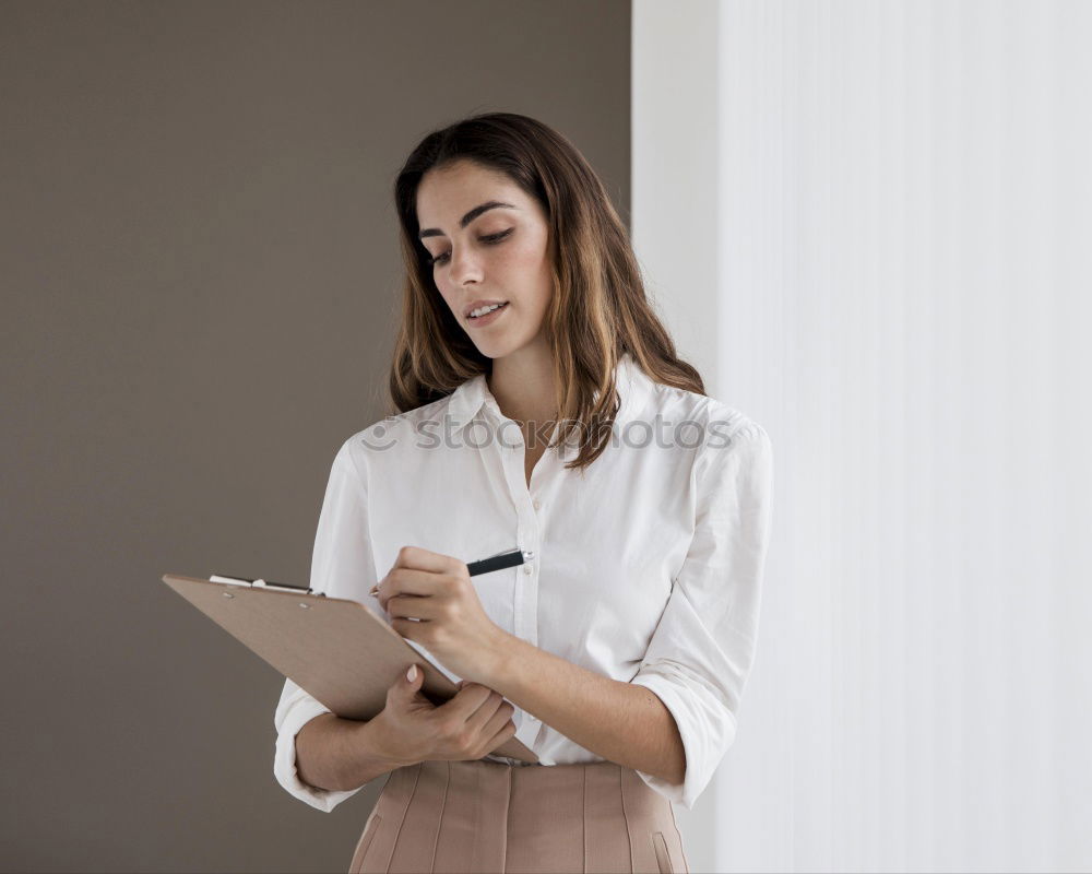 Similar – Image, Stock Photo Young businesswoman with tablet computer standing outside of an office building