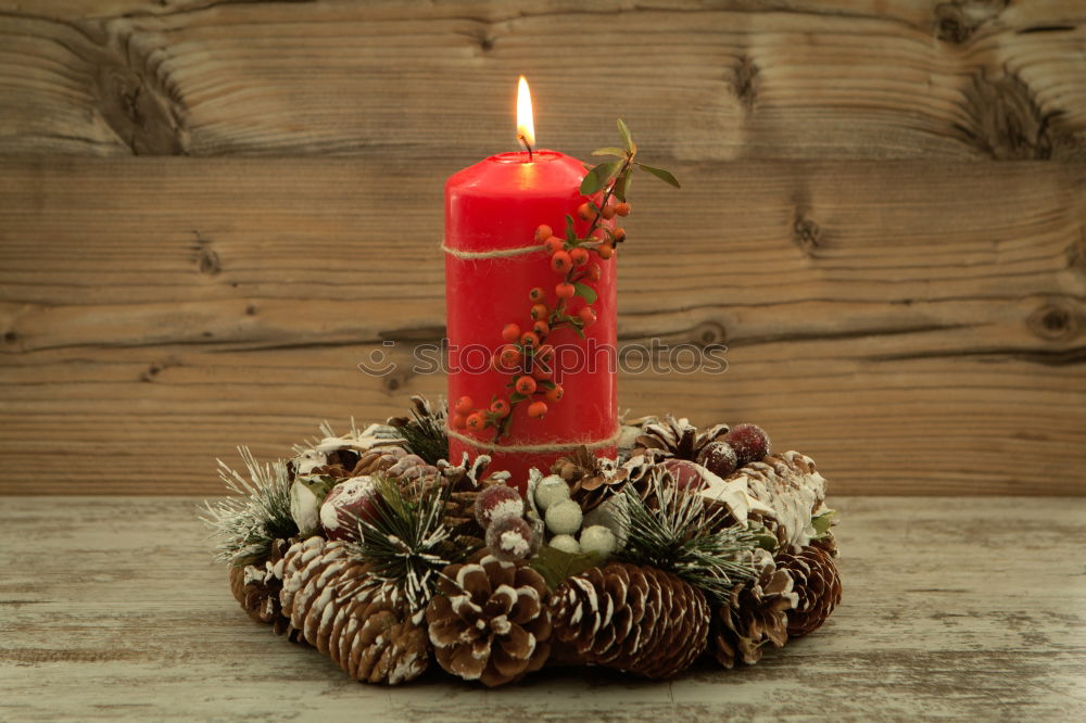 Similar – Lighted candles with red colored pearls around