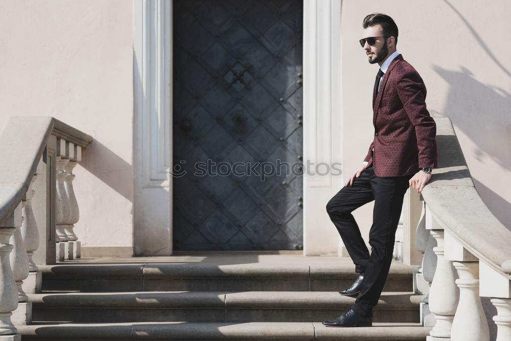 Similar – Young bearded man, model of fashion, sitting on urban step