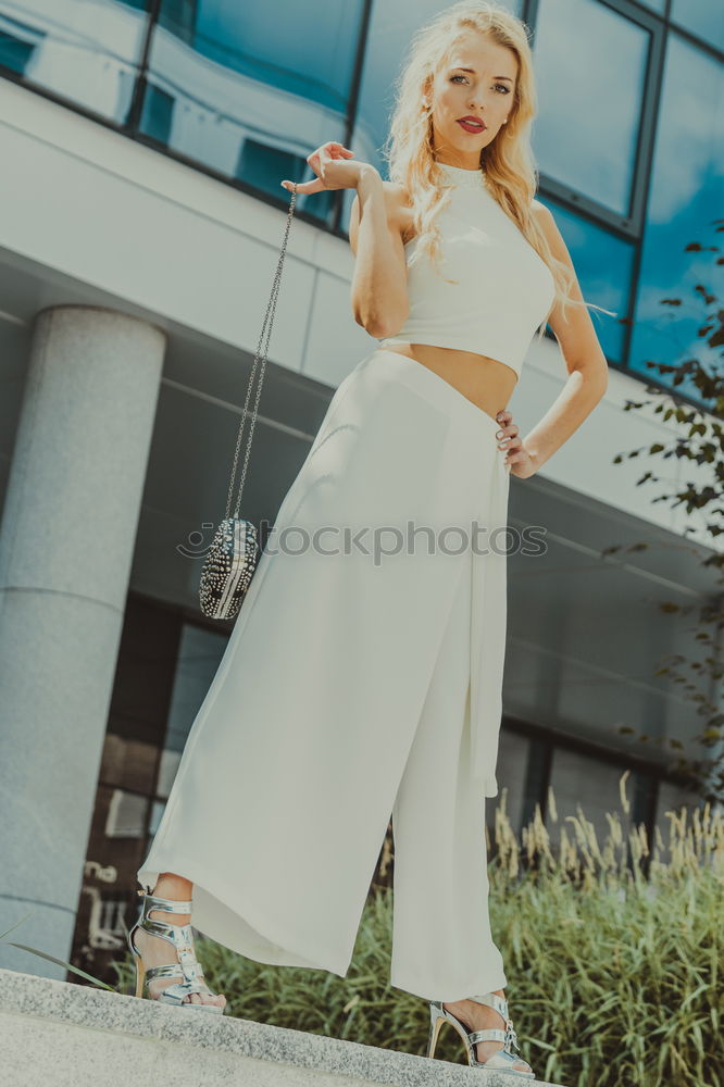 Similar – Image, Stock Photo Funny young blonde woman standing on urban background.