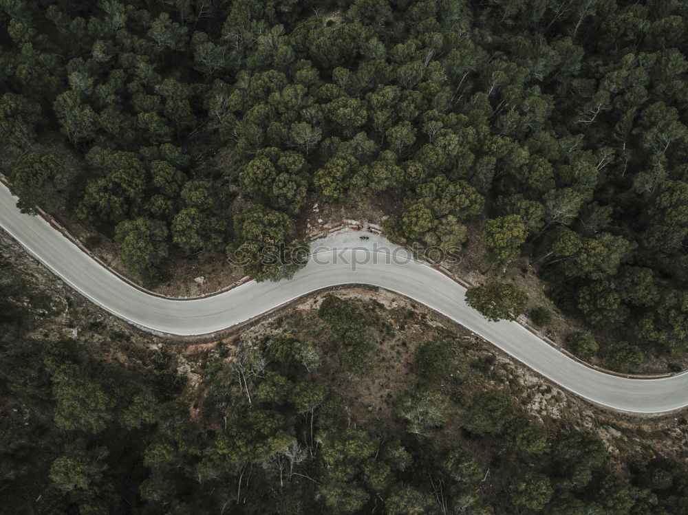 Similar – Aerial view of a road along the river