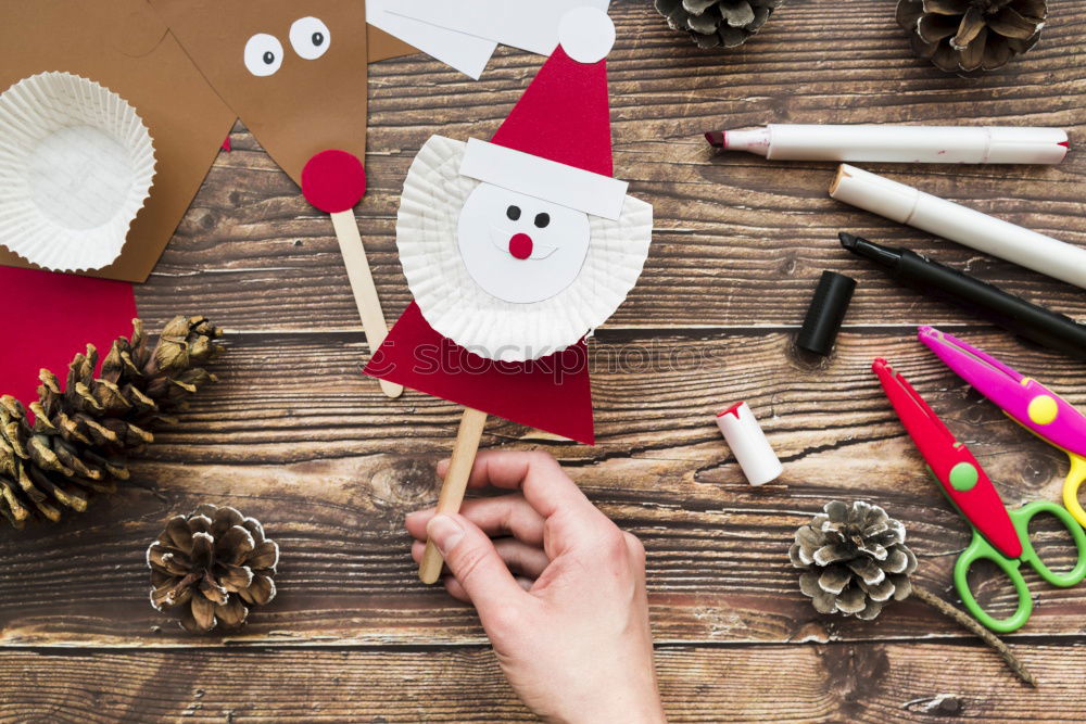 Similar – Image, Stock Photo Girl making Christmas tree decoration from paper