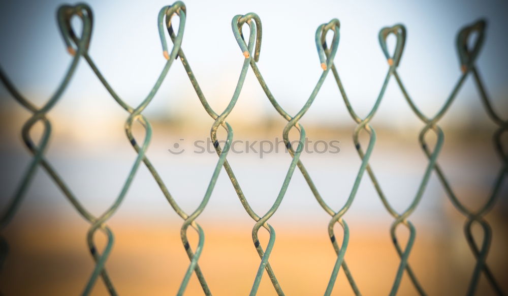 Similar – Gymnastic ring hanging in gym