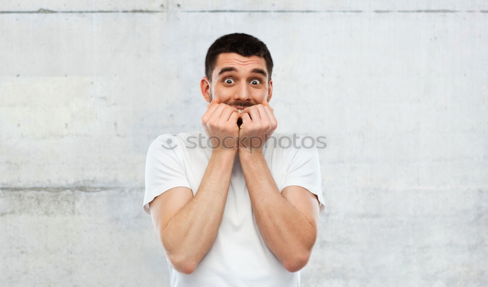 Similar – Boy making face with hands on seat