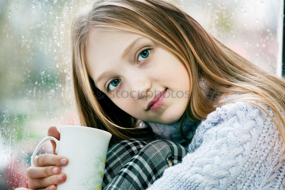 Similar – kid girl drinking hot cocoa at home in winter