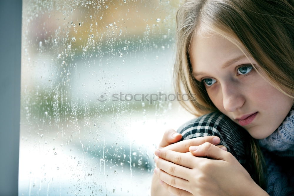 Similar – Mother and son looking through a train window as they enjoy a days travel with the small boys face reflected in the glass