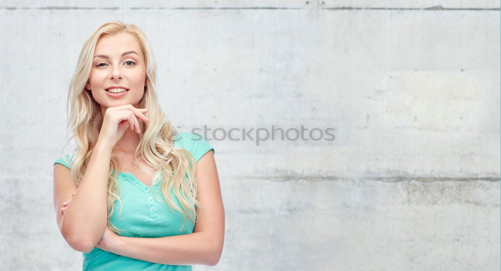 Similar – Smiling blonde girl with red shirt enjoying life outdoors.