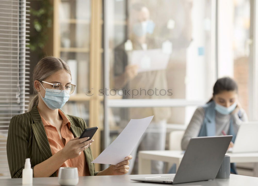 Similar – Young Businessman Wearing Mask Working On Laptop At Hot Desk In Office During Health Pandemic