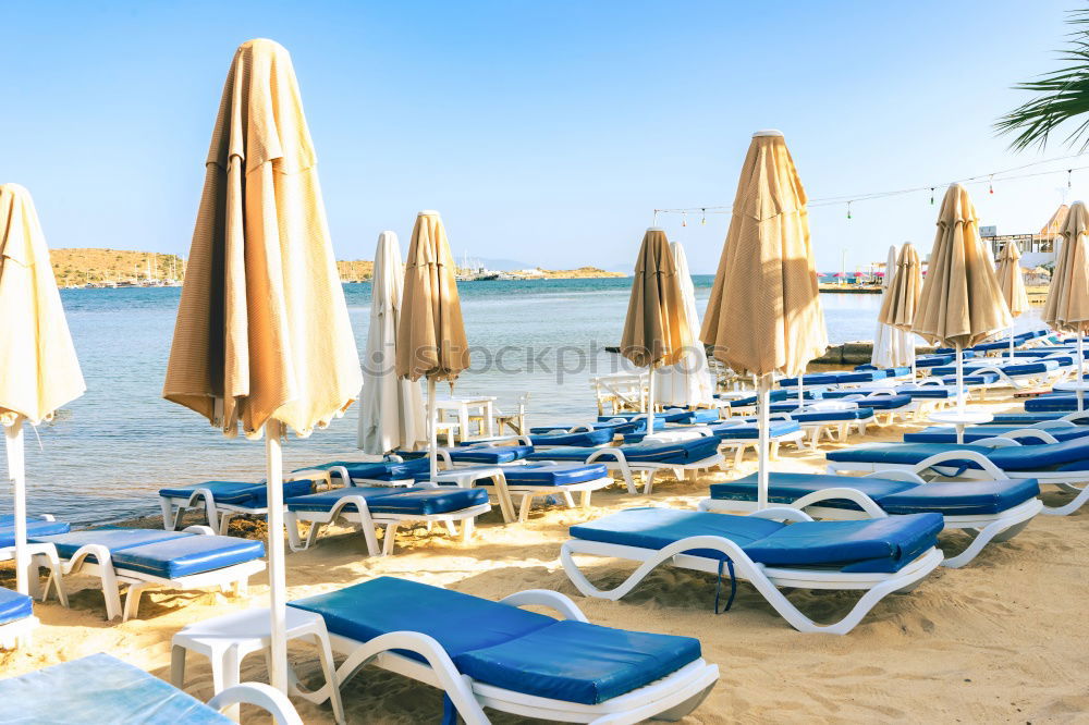 Similar – Image, Stock Photo Empty loungers on the beach